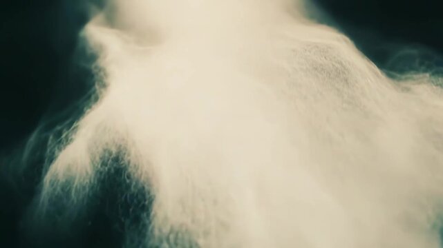 Smoke and vapor patterns gently swirl and dissolve into a dark, ethereal background, suggesting fluid motion, mystery, cosmic atmosphere, and soft, dynamic texture effects