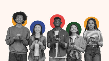 Five young adults stand in a line, all focused on their smartphones. They smile as they engage with...