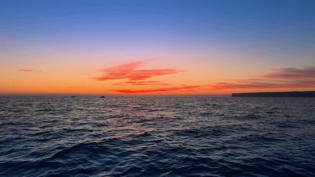 Costa Blanca sunrise over calm Mediterranean sea and coastal horizon