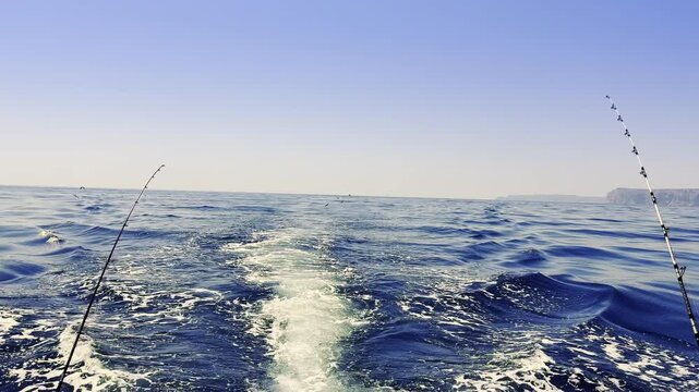 Costa Blanca trolling fishing boat wake on blue Mediterranean sea