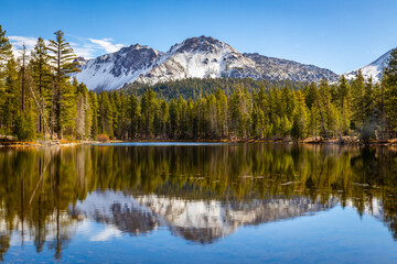 Snowy Lassen Peak reflected in Manzanita Lake waters
