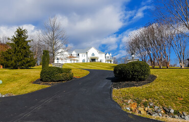 Obraz premium Modern House in suburb. Brick house with nice landscape. Autumn landscape.