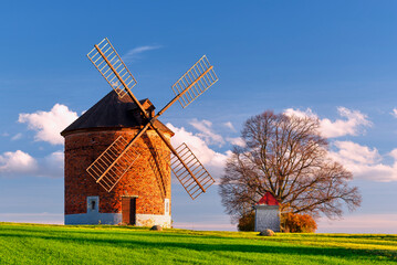 Windmill, a beautiful landscape landmark in Chvalkovice in South Moravia before autumn sunset
