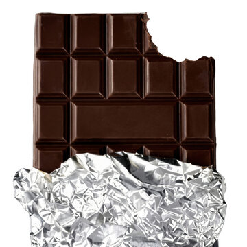 Bitten dark chocolate bar partially unwrapped showing silver foil on a dark setting