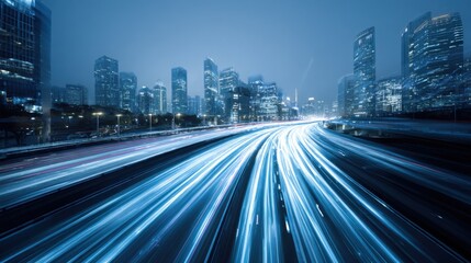 Fototapeta premium Bright city lights illuminate the skyline at night showcasing tall skyscrapers and dynamic traffic streams on a highway in a bustling urban environment.