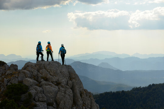Trekking group exploring mountains in early morning light