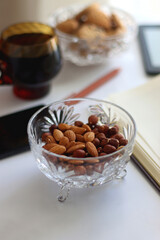 Notebook, pen, tablet, phone, coffee and snacks on white background. Selective focus.