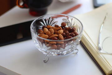 Notebook, pen, tablet, phone, coffee and snacks on white background. Selective focus.