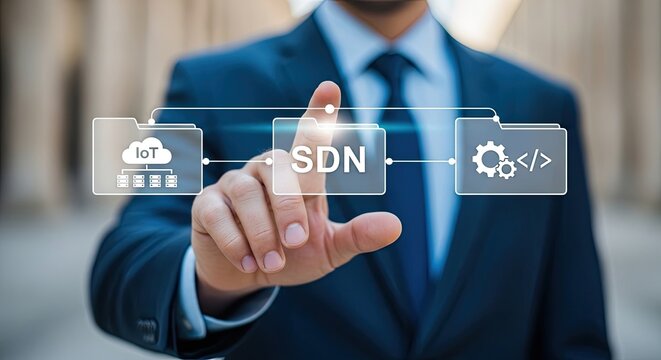 Businessman in Dark Suit and Blue Tie Touching a Virtual SDN Folder with IoT and Gear Icons