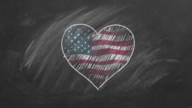 National flag of United States in heart shape  drawn with colored chalk on a blackboard.