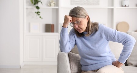 Amnesia. Senior woman trying to remember something at home, space for text © New Africa