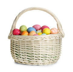 Fototapeta premium Painted Easter eggs in wicker basket isolated on white