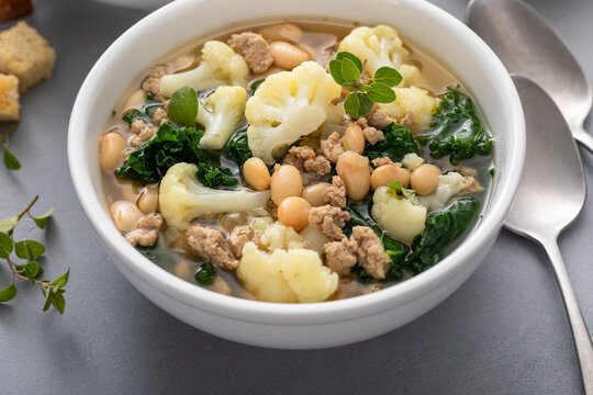 Healthy bean and turkey soup or stew with kale and cauliflower