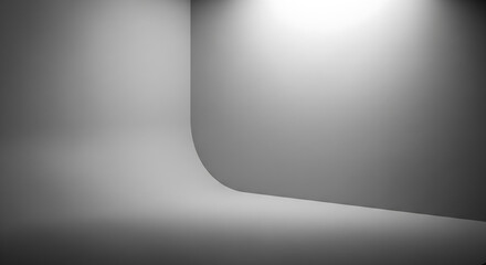 Naklejka premium Minimalist grey studio background with soft lighting, perfect for product placement and advertising campaigns.
