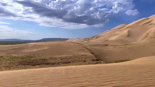 Khongoryn-Els in Mongolia is known as the "Singing Dunes" because of the sounds made by the shifting sands. The Gobi Desert. The dunes are up to 300 m. high. The "Light Red Sands" stretch for 185 km. 