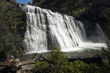Couple admiring the majestic &Ntilde;ivinco Waterfall