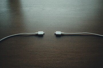 Close-up of two cables symbolizing power and data transfer