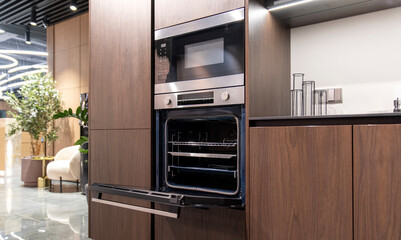 Built-in oven and microwave appliance display in modern kitchen