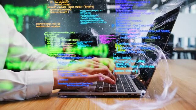 close up of hands typing on a laptop keyboard with glowing digital computer code and colorful abstract light energy floating above the office workspace