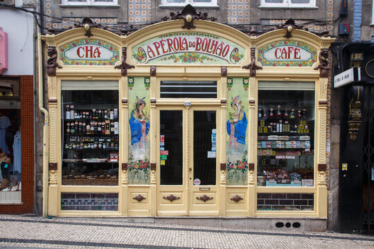 A Perola do Bolhao Cafe store ornate belle epoque facade on a typical historical portuguese style building in Porto, Portugal
