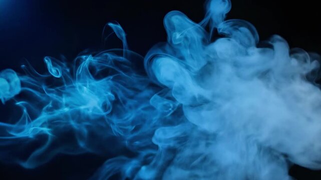 A vibrant blue smoke cloud disperses against a dark background, with tendrils stretching out