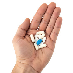 Hand holding various pills
