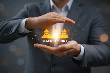 Hands protecting safety icons with safety first text symbolizing workplace safety risk prevention employee protection industrial standards health awareness and corporate responsibility concept