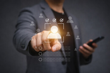 Business professional selecting glowing candidate symbol for recruitment decision, talent screening, human resource management, workforce selection and hiring process concept.