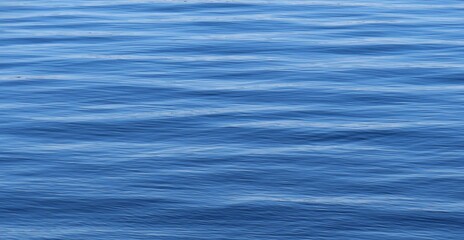 Light blue smooth water surface, natural background