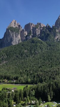 Schlern mountains in dolomites of  northern italy (italian south tirol) dolomite mountain view from below aerial blue sky clear sunny day travel hiking hike destination europe Alpe di Siusi tourism