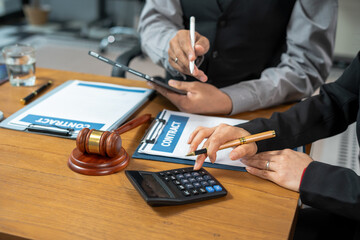 Lawyer or accounting department writes a note and uses a calculator to calculate expenses - income....