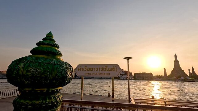 Golden Hour Sunset Over Chao Phraya River and Wat Arun Temple