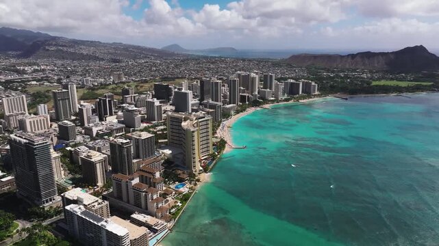 Aerial view of Honolulu Waikiki beach on a sunny day, blue water Hawaii Oahu 4K