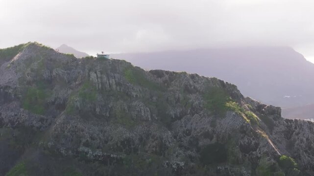 Old bunker on a grassy hill, sunny drone video, Lanikai Pillbox, Oahu Hawaii 4K
