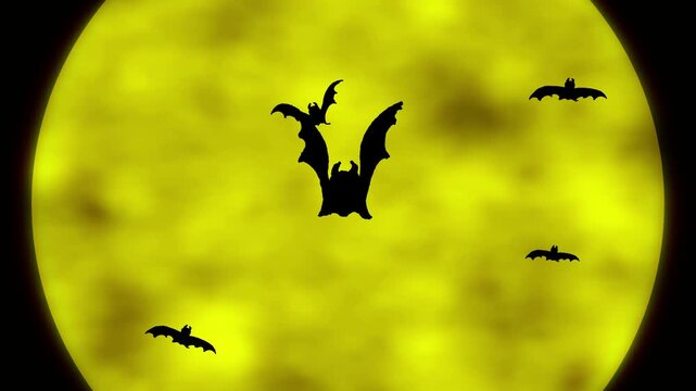 Animated bats with wings flapping against a yellow Halloween moon with clouds. Halloween cartoon.
