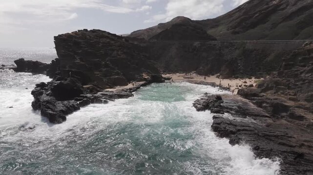 Kahauloa Cove with medium waves, drone video, Oahu Hawaii 4K