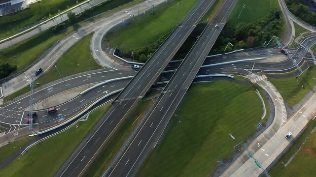 Johnson City, USA Aerial Johnson City Highway Interchange Dusk With Quiet Lanes And Curved Ramps, Architectural Symmetry And Green Embankments Soft Evening Light, Minimal Traffic, Sweeping