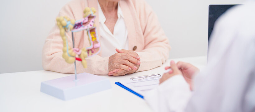 Elderly woman Patient consultation with doctor for Colon disease, Large Intestine, Colorectal cancer, Ulcerative colitis, Diverticulitis, Irritable bowel syndrome, Digestive system and Healthcare