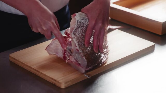 Japanese Chef Filleting Sea Bream into Three Pieces Traditional Style