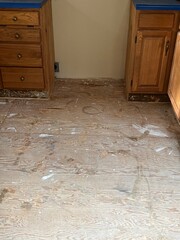 A plywood subfloor in a kitchen