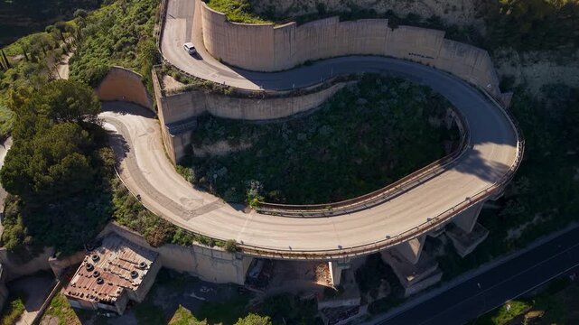 Rising aerial view above Villa Corradino terraced gardens on Centuripe historic hilltop town Sicily