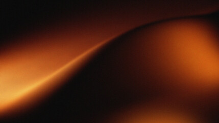 Orange, brown, and black colors that resemble folds of fabric or sand dunes in low light. The texture appears grainy, giving it a cinematic or artistic feel. © Mifta