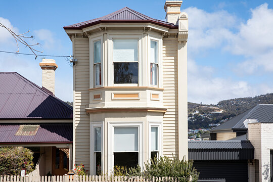 Victorian era house with bay windows and ornate architectural details on a sunny day in Hobart, Tasmania