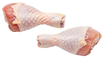 Two raw chicken drumsticks, isolated on black. The poultry displays a smooth, light skin texture and vibrant pink meat