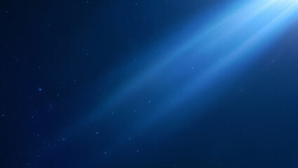 Fototapeta premium Deep blue space background with bright blue light rays and sparkling stars.