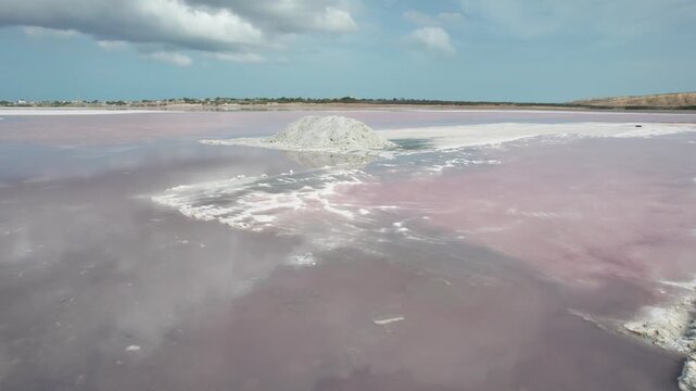 Aerial view of pink salt pans and salt piles in Araya Venezuela