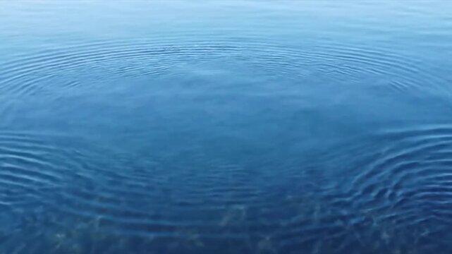 Shimmering Liquid Textures Low angle, capturing the interplay of light and reflections on the moving surface.