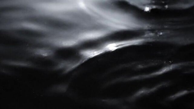 Shimmering Surface Highlight the dazzling and constantly shifting specular highlights created by the top-down illumination.