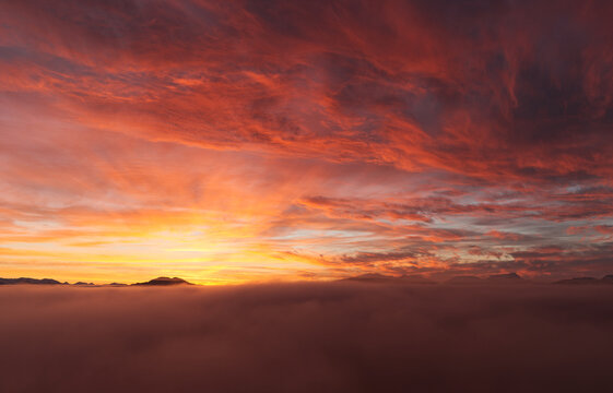 Colorful sunset over fog layer in Alaska