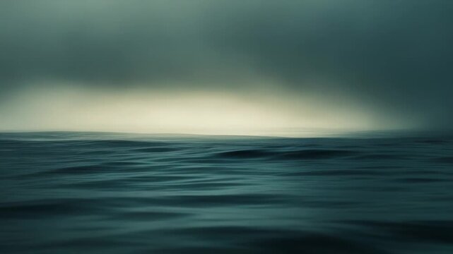 Dark blue ocean waves drift beneath a hazy glowing horizon and vast calm sky, an atmospheric, minimalist seascape evoking tranquility, depth, and quiet contemplation